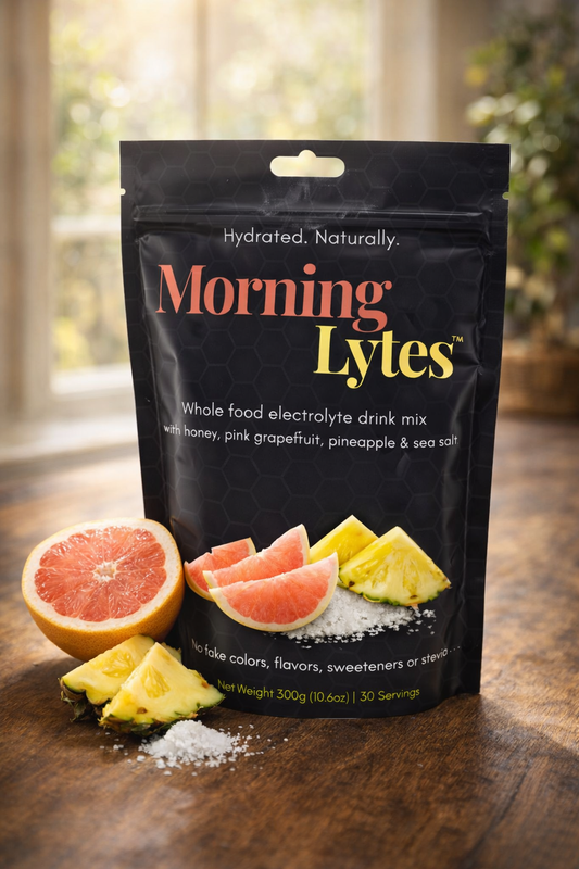 Morning Lytes electrolyte drink mix package with fruit slices on a wooden surface